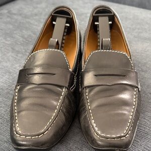 Tod’s Women’s Black leather Penny Loafer with Rubber sole slip on Driving shoe